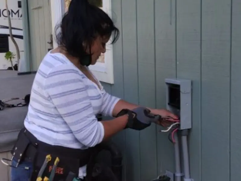 Licensed electrician wiring an exterior subpanel in Los Altos Hills