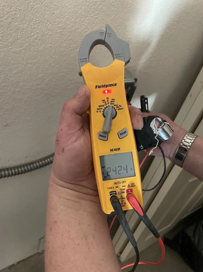 Voltage testing with clamp meter during Outlet Installation in Los Altos Hills